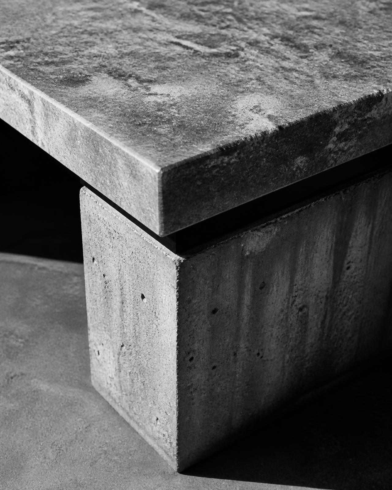 Close-up of a stone table top on a concrete base